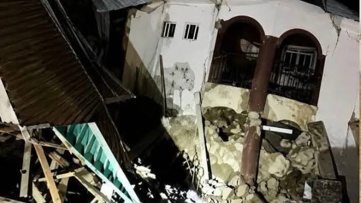 Rescue workers searching the rubble after the Oko hostel collapse in Anambra State