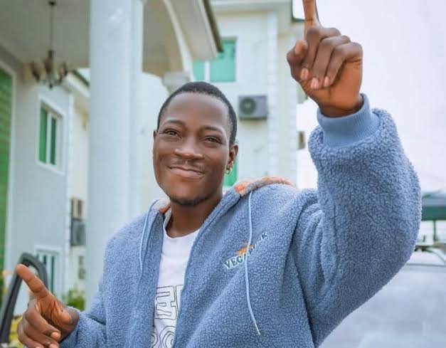 DJ Chicken celebrating his release from Kirikiri Correctional Centre alongside his lawyer