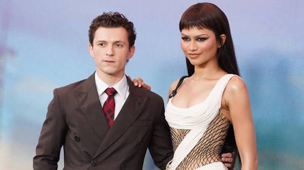 Tom Holland discussing his latest Spider-Man scenes with Zendaya during a BBC News interview
