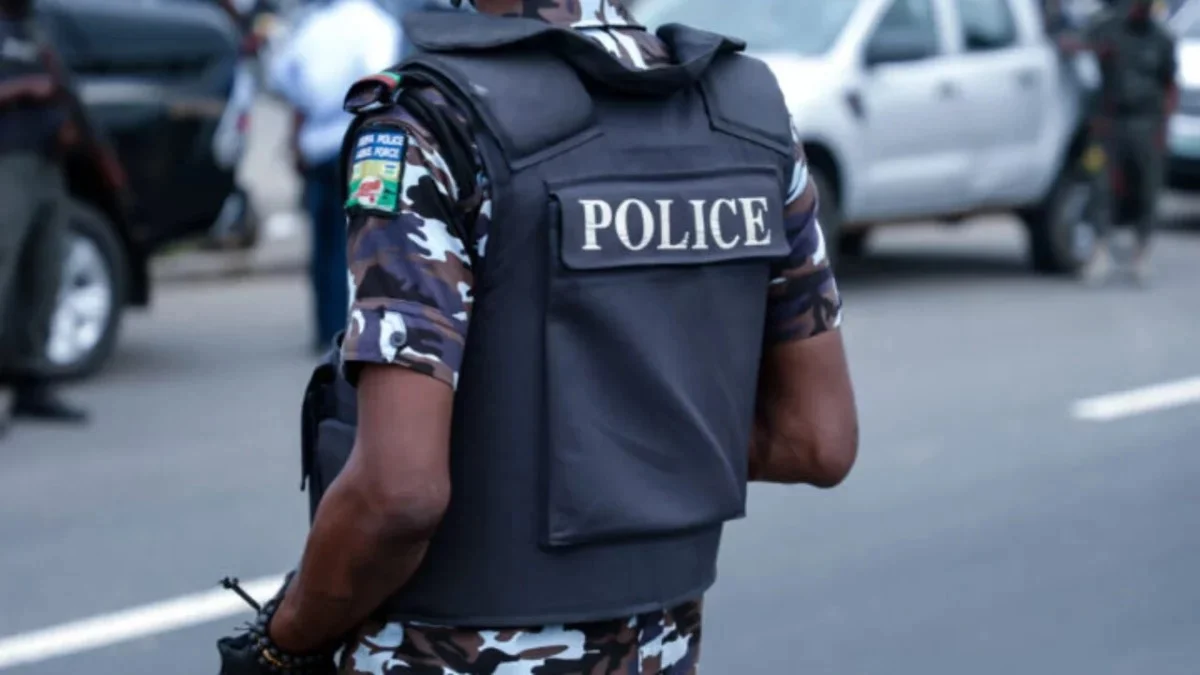 Abia State Police officers following the arrest of a suspected child trafficker and rescue of six children