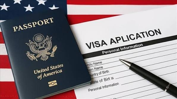 US visa documents as the State Department pauses immigrant visa interviews worldwide