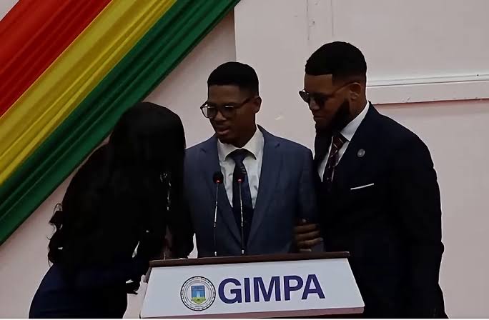 Ghanaian MP Francis-Xavier Sosu assisted after collapsing during a speech at GIMPA