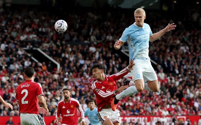 Erling Haaland celebrating Manchester City’s controversial winner against Manchester United at Old