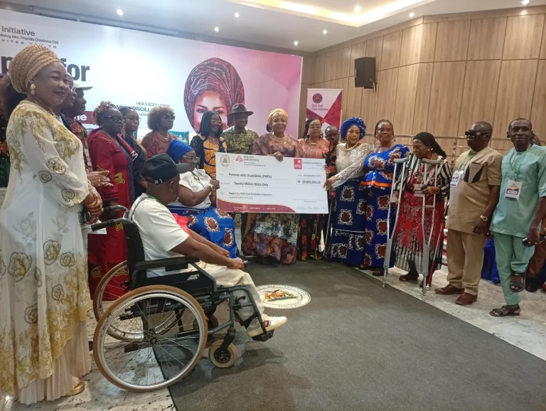 Priscilla Otti presenting support to women living with disabilities in Abia State