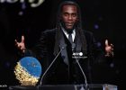 Burna Boy presenting the 2026 Sócrates Award to Arsenal winger Bukayo Saka at the Ballon d'Or ceremony in London.