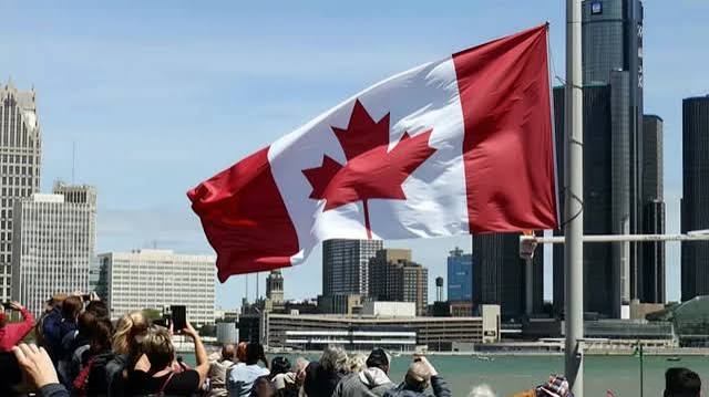 Canadian national flag accompanying a report on Nigerian-born Joseph Adams' election victory in Ontario.