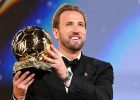 Harry Kane holds the 2026 Ballon d'Or trophy during the awards ceremony at the London Palladium.