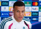 Real Madrid forward Kylian Mbappé speaking at a football press conference.